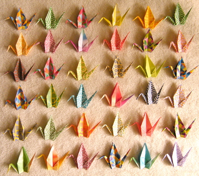 Rows of origami cranes stand ready for you to adopt them and help rebuild Japanese communities with your donation to the 1,000 Cranes Community Recovery Project.